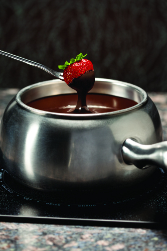 Dipping a Strawberry into Chocolate Fondue 