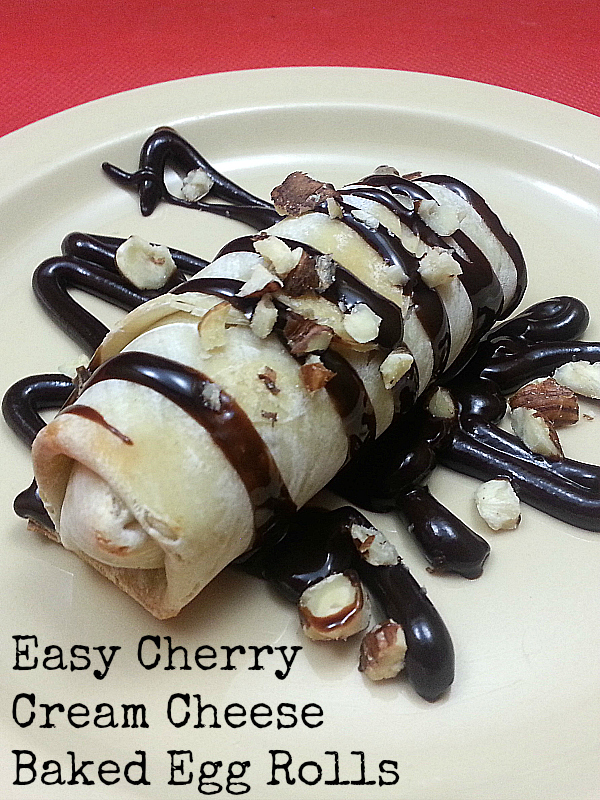 Cream Cheese Cherry Baked Egg Rolls Recipe for Dessert - Chocolate Drizzle and Chopped Hazelnuts on top