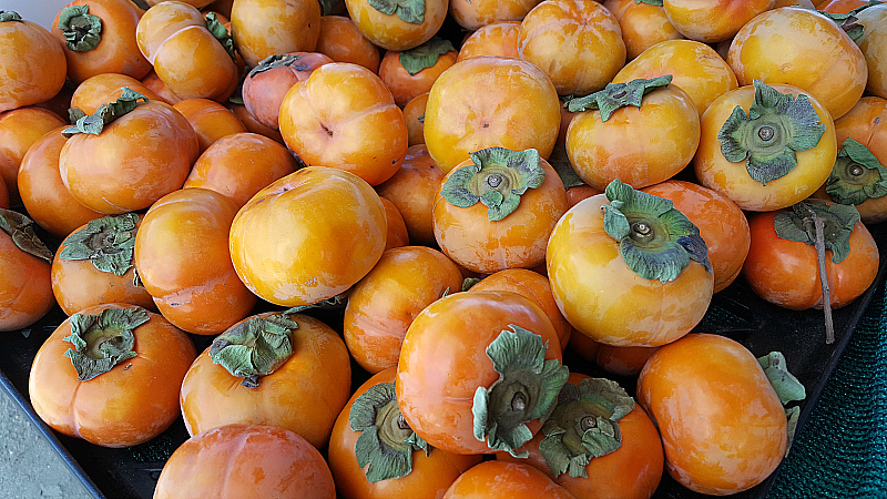 Fuyu Persimmons at SoCo Farmer's Market - Costa Mesa, California