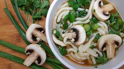 Bowl of Vegetarian Udon Noodle Soup with mushrooms