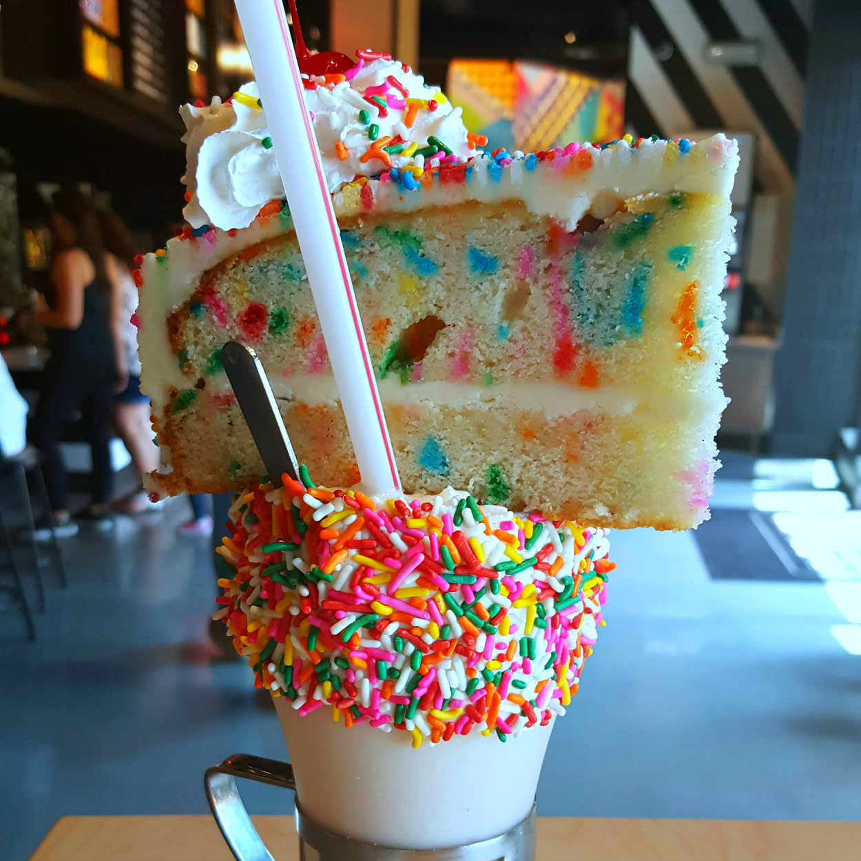 birthday cake shake milkshake topped with cake