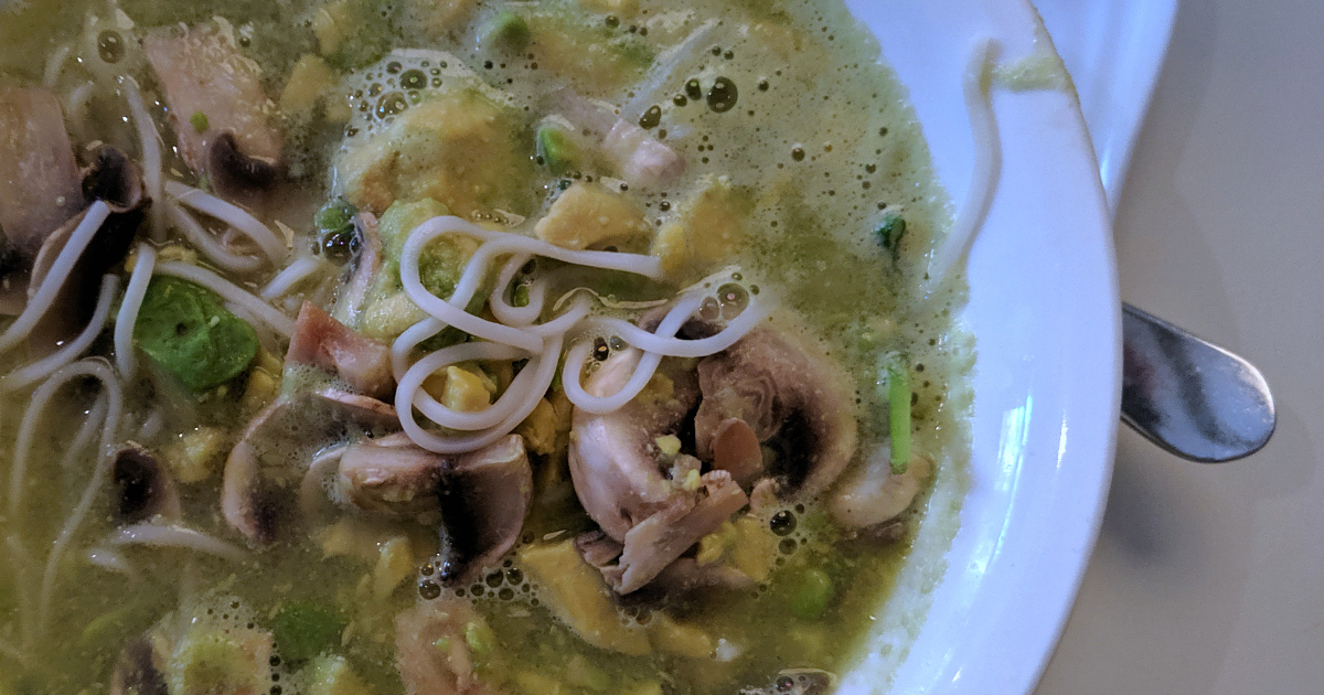 bowl of vegan avocado mushroom noodle soup