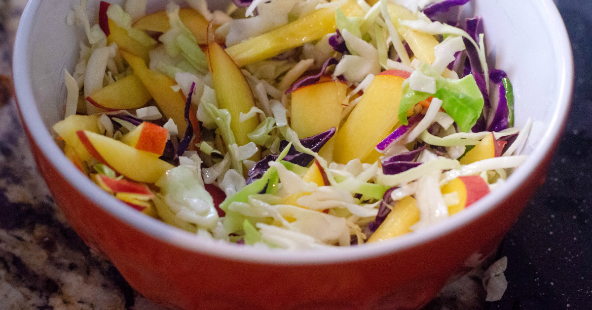 fruit slaw in mixing bowl