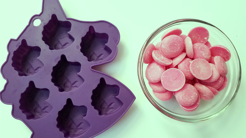 purple silicone unicorn mold and pink candy melts