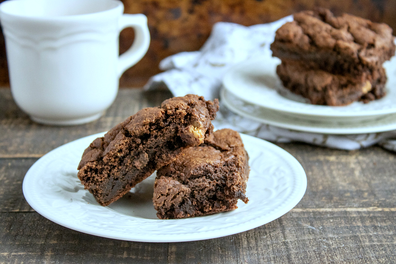 brownies on white plate with coffee cup