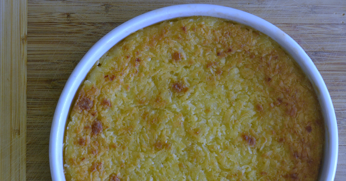 coconut pie in white baking dish on cutting board