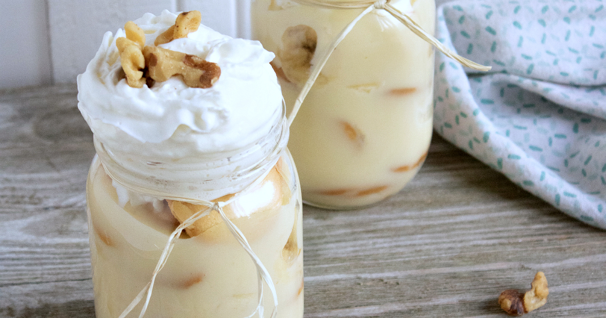 banana pudding topped with whipped cream and walnuts