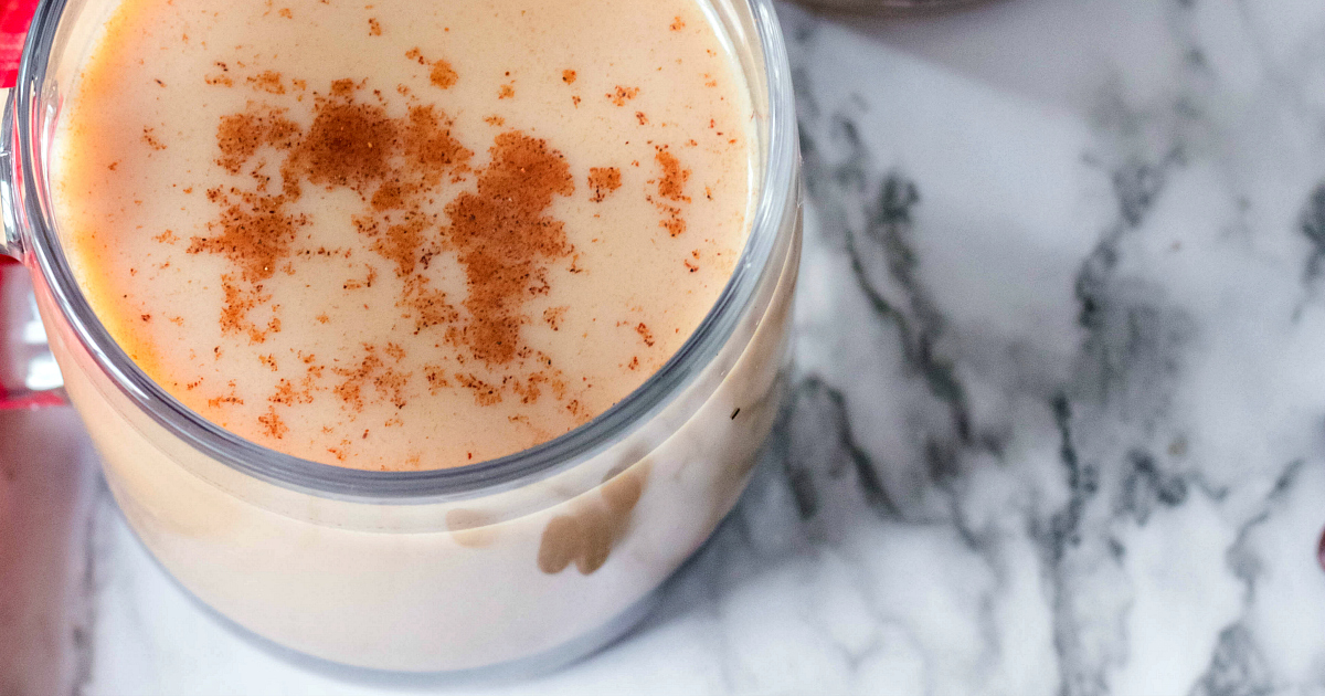 overhead view of adult coffee topped with cinnamon