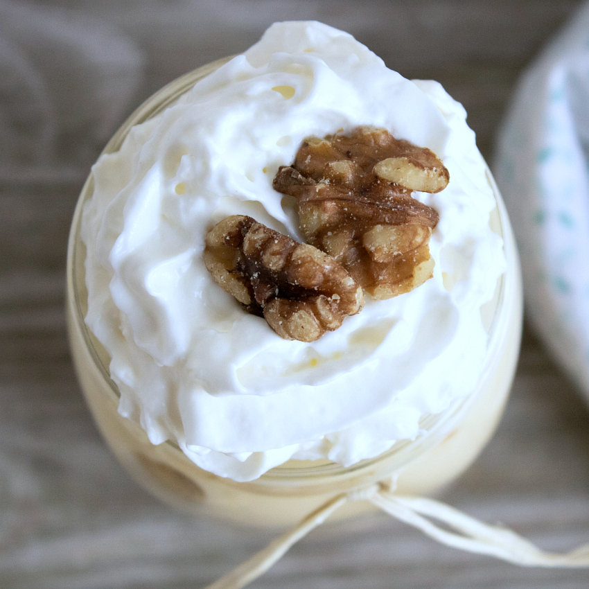 whipped cream and walnuts on top of banana pudding