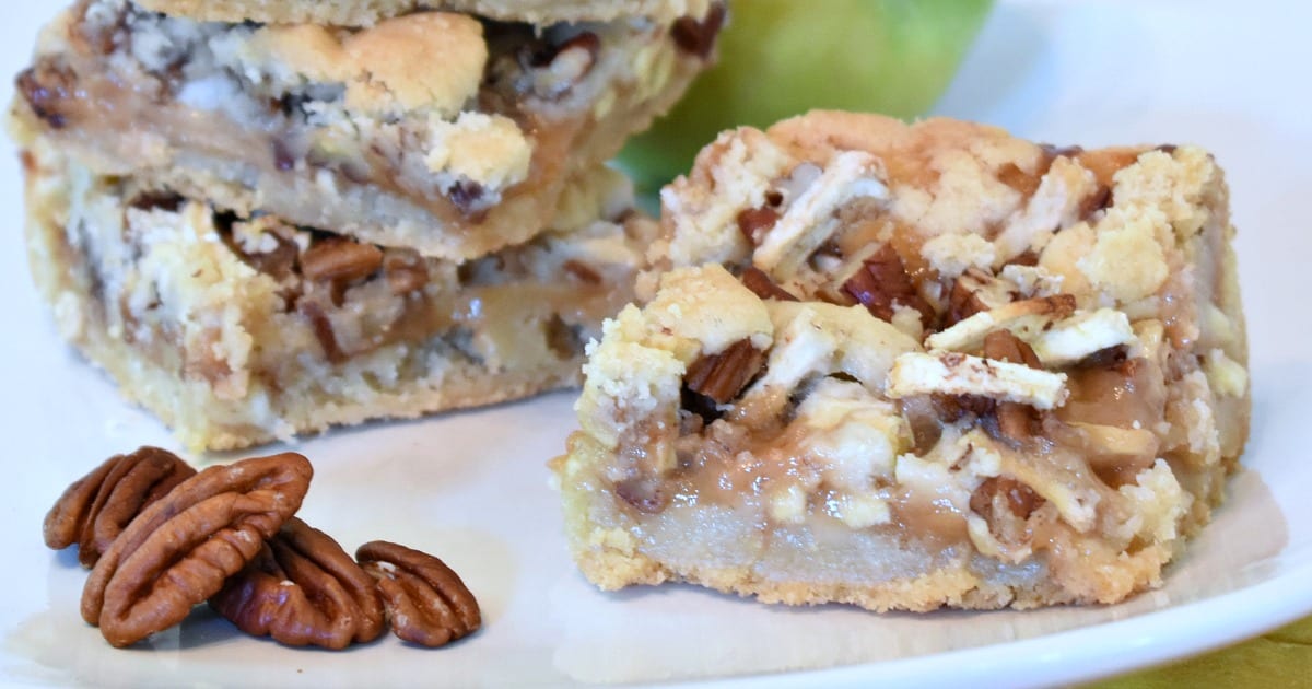 close up caramel apple cookie bars and pecans