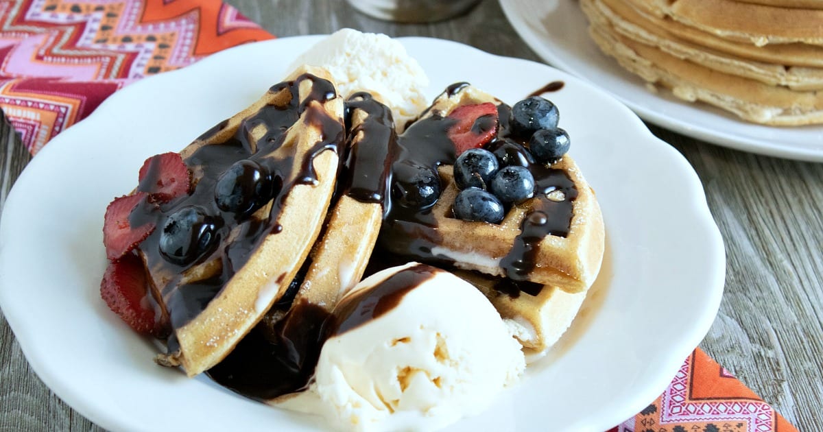 waffle sundae with chocolate sauce and berries