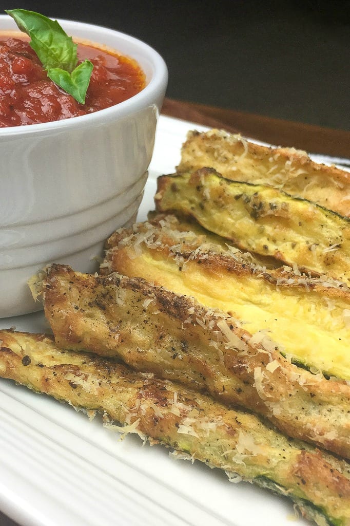 The Crispiest Gluten Free Baked Zucchini Fries Recipe #GlutenFree #Zucchini Crispy gluten free baked zucchini are delicious and fun to eat, so you'll want to serve them at parties and as a regular family snack or side dish. 