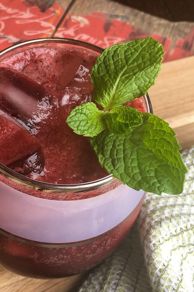 Dark Cherry Gin Fizz Cocktail with a Mint Garnish #Cocktail #GinFizz #GinCocktail #CherryCocktail