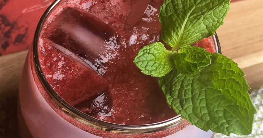 overhead view of dark cherry gin fizz