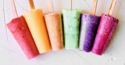 a rainbow of fruit popsicles