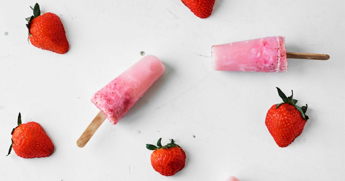 feature creamy vegan strawberry popsicles