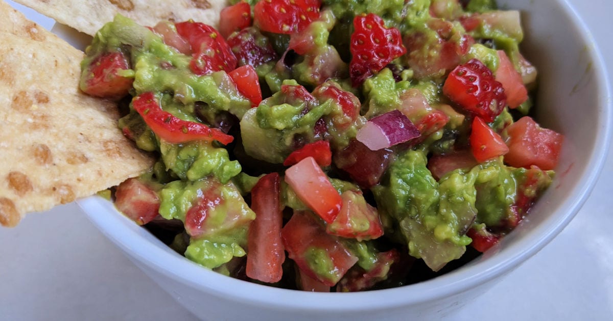 white bowl of strawberry guacamole