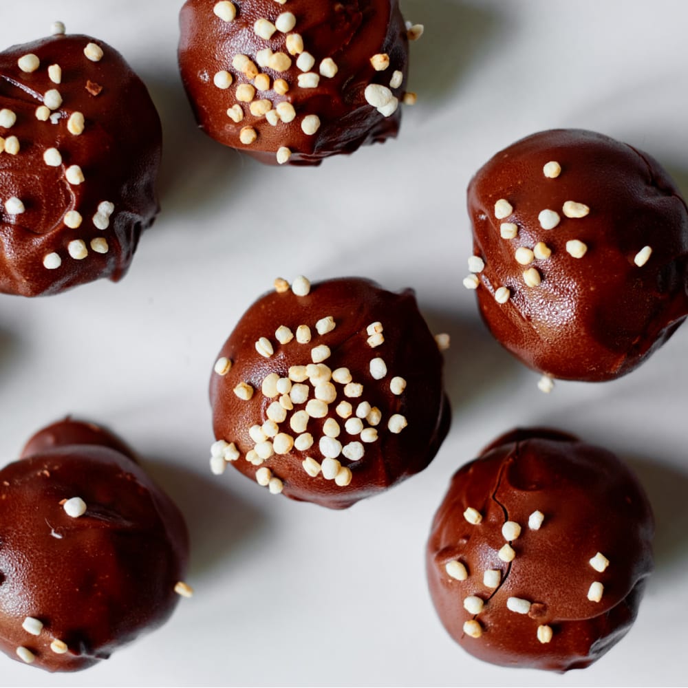 gluten free chocolate banana truffles topped with puffed quinoa