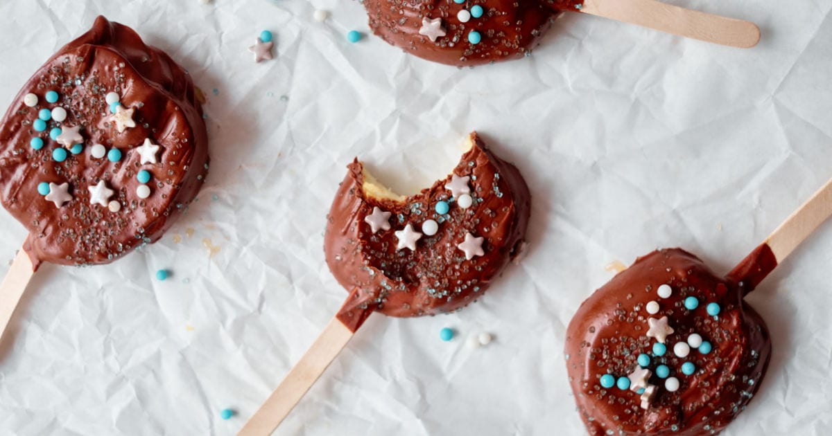 chocolate dippled apple slices on parchment