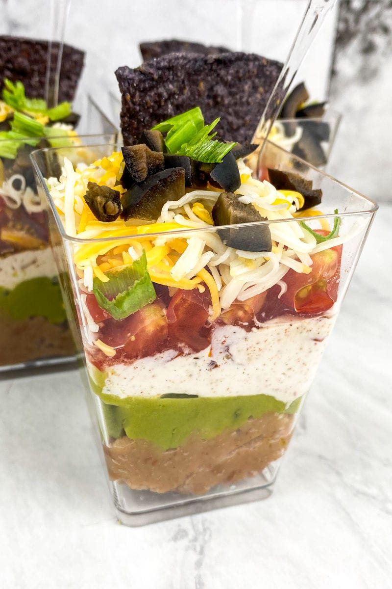 Ditch the boring dip bowl and enjoy these individual Mexican dip snack cups. They are the perfect bite-sized party pleaser, packed with fresh flavor and customizable for picky eaters. Easy to make, impressive to serve, and perfect for any occasion!