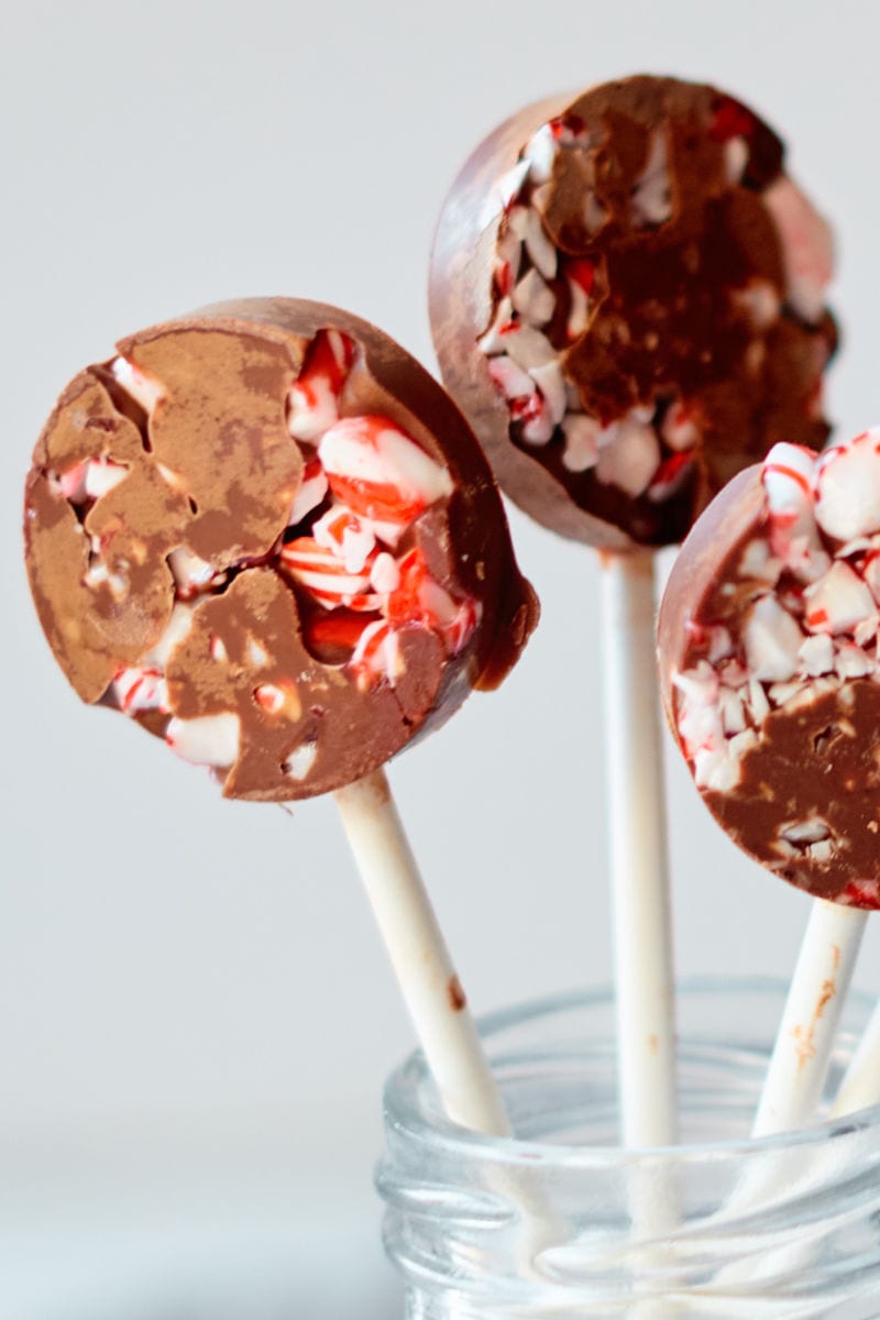 Chocolate Peppermint Lollipops Recipe that is easy to make with crushed candy canes and milk chocolate.