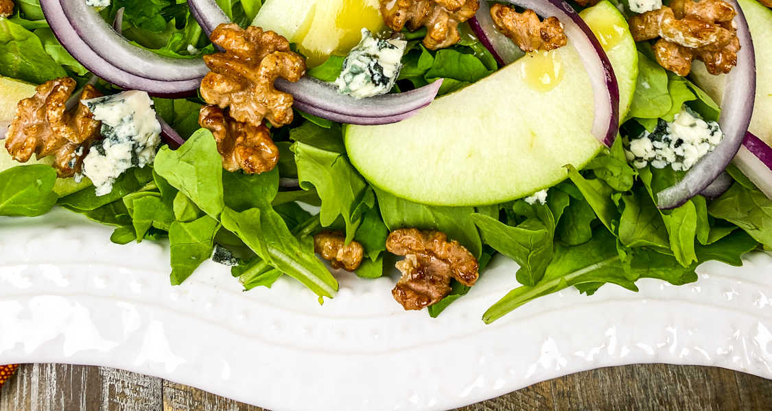 apple walnut salad on white platter