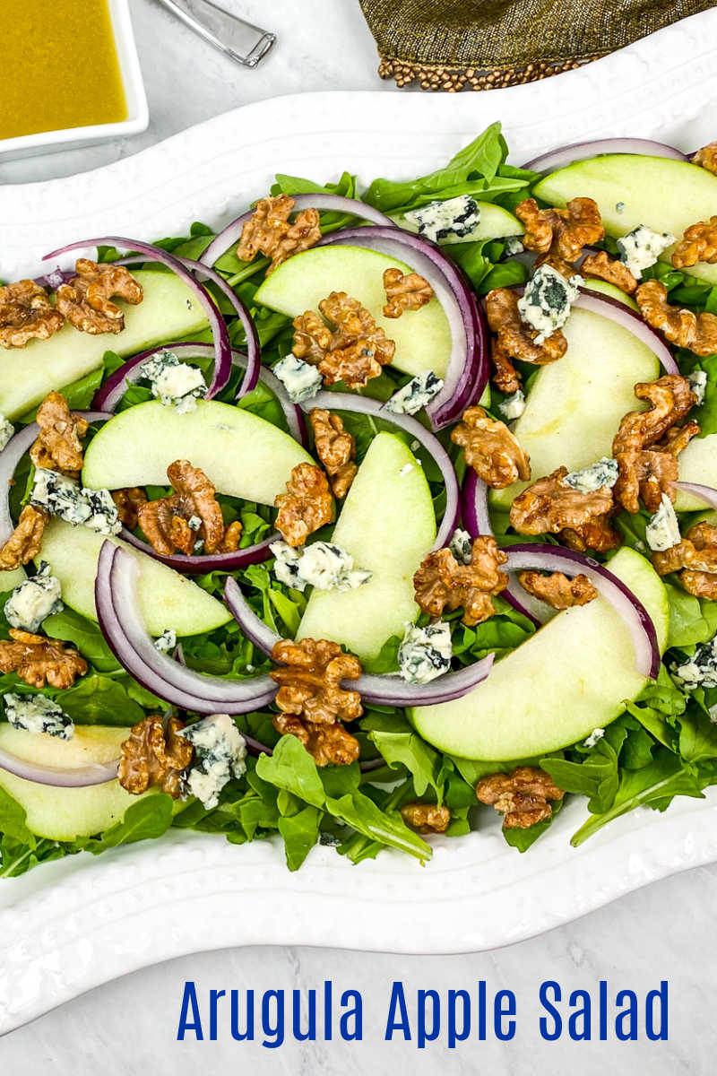 This arugula apple salad has blue cheese and honey roasted walnuts mixed in, so you will love each flavorful bite.