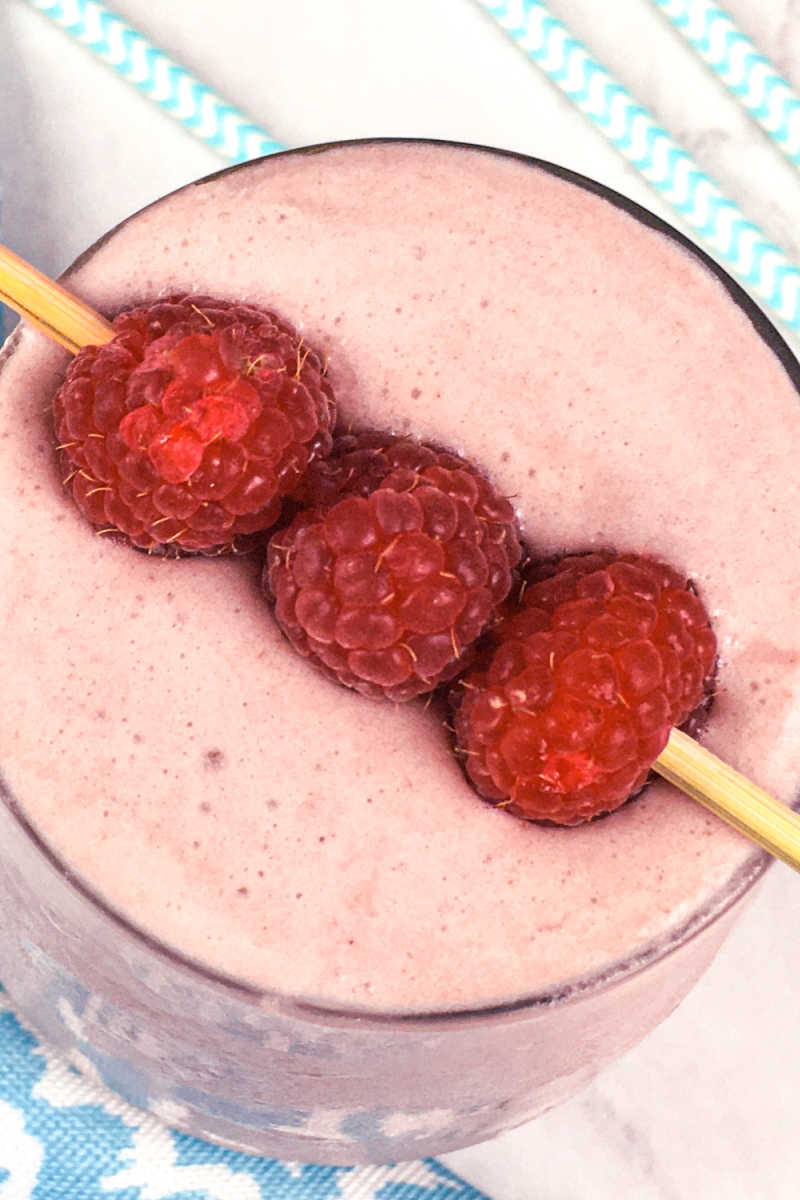 This keto raspberry coconut smoothie is a delicious for vegans, people who follow a low carb diet or anyone who wants a tasty protein drink. #keto #vegan #lowcarb