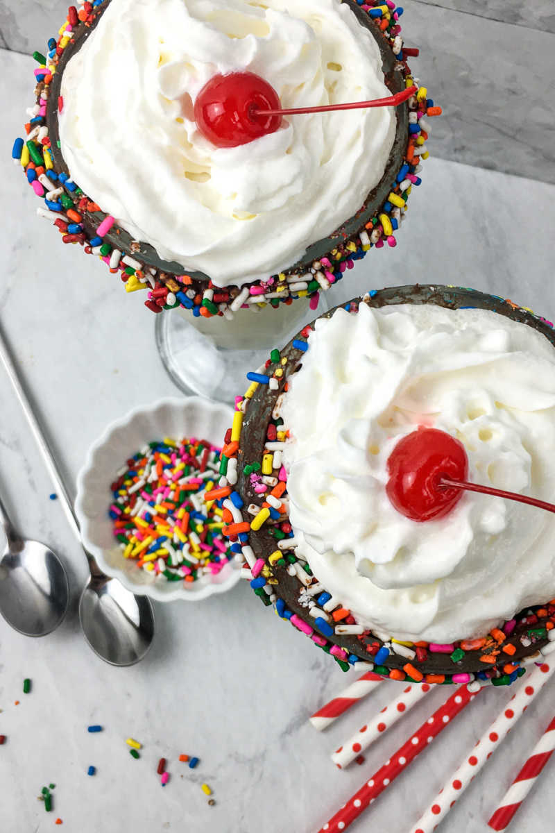 It's time to celebrate, when you make a birthday milkshake with rainbow sprinkles and a chocolate dipped soda glass.