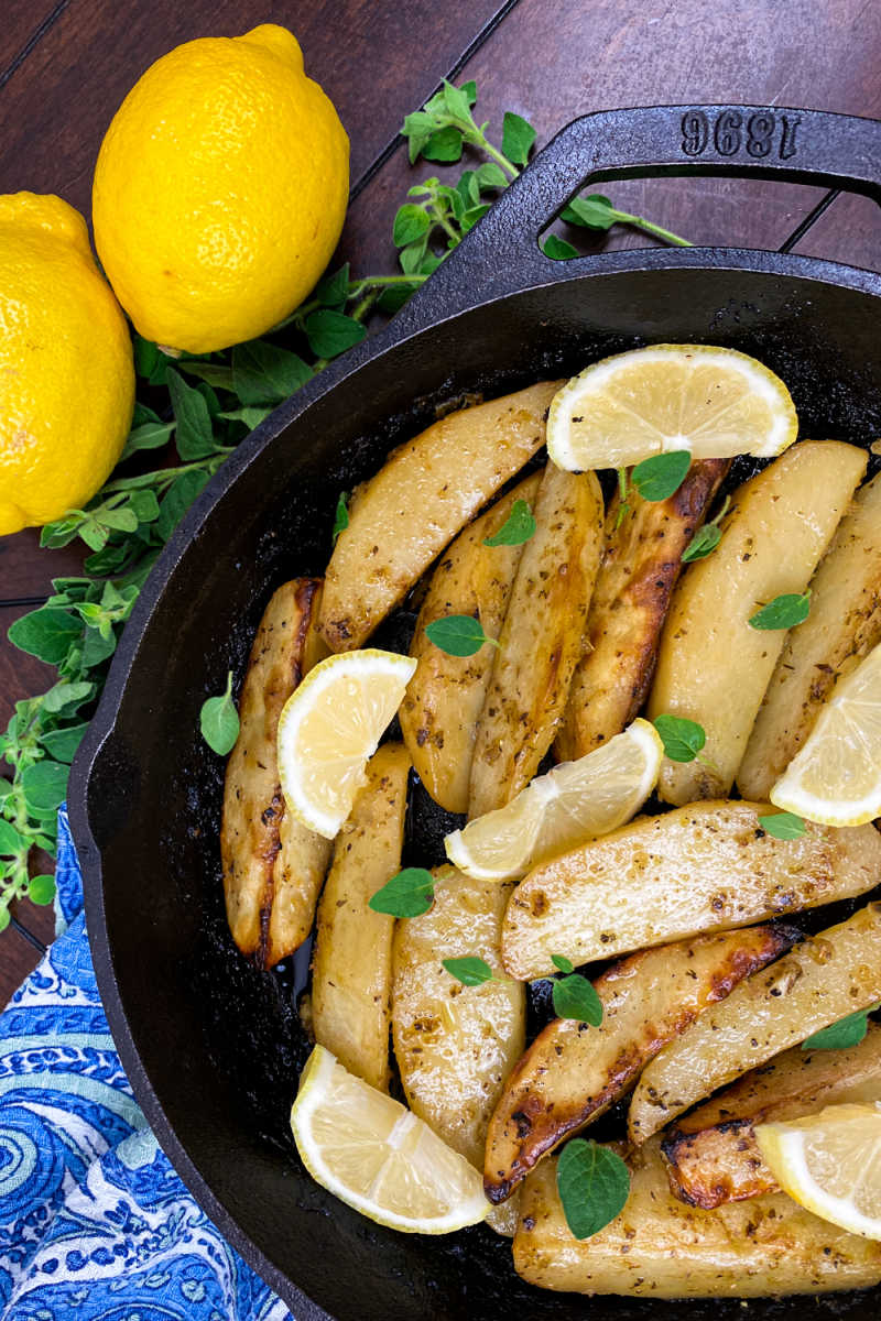 Enjoy these lemon cast iron skillet Greek potatoes, when you want a budget friendly dish that has traditional Mediterranean flavors.