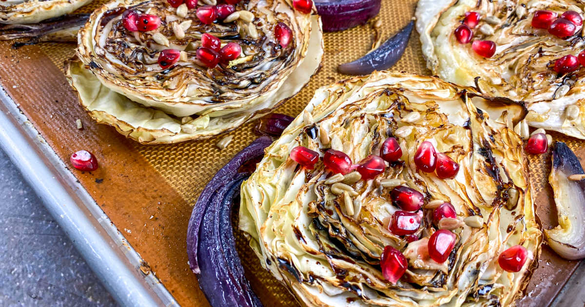 roasted balsamic cabbage steaks on baking sheet.