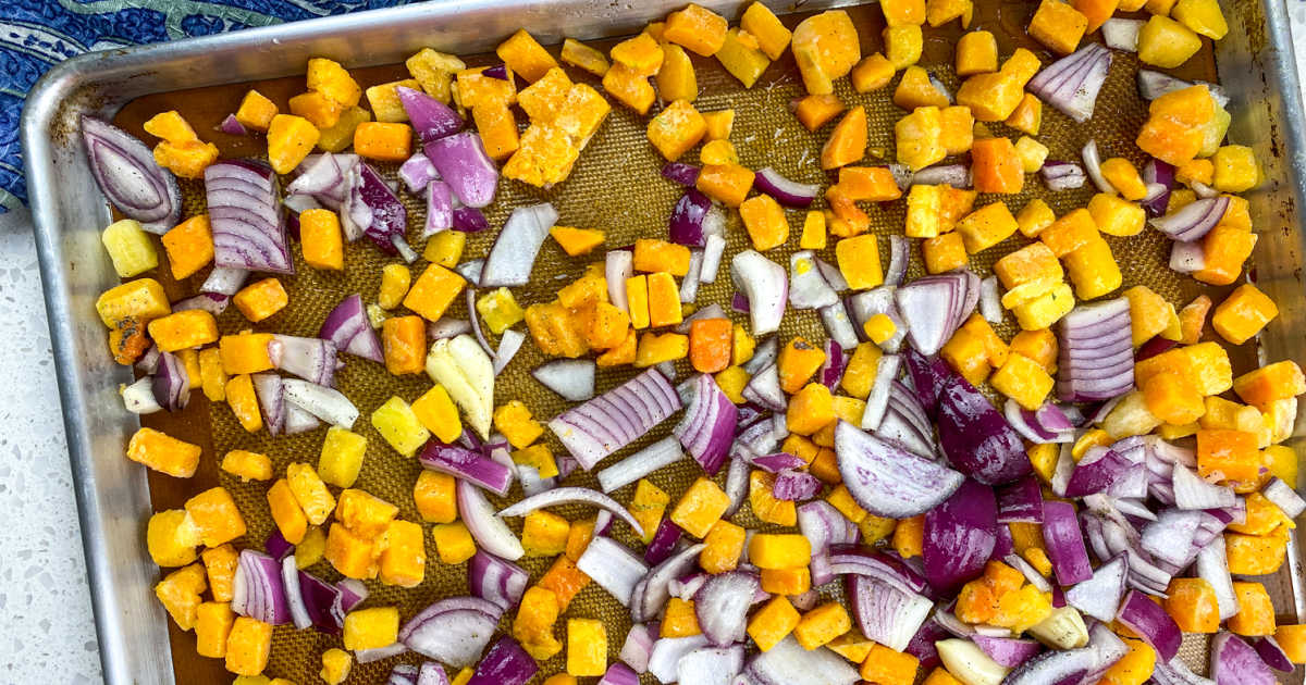 butternut squash and onions on baking sheet