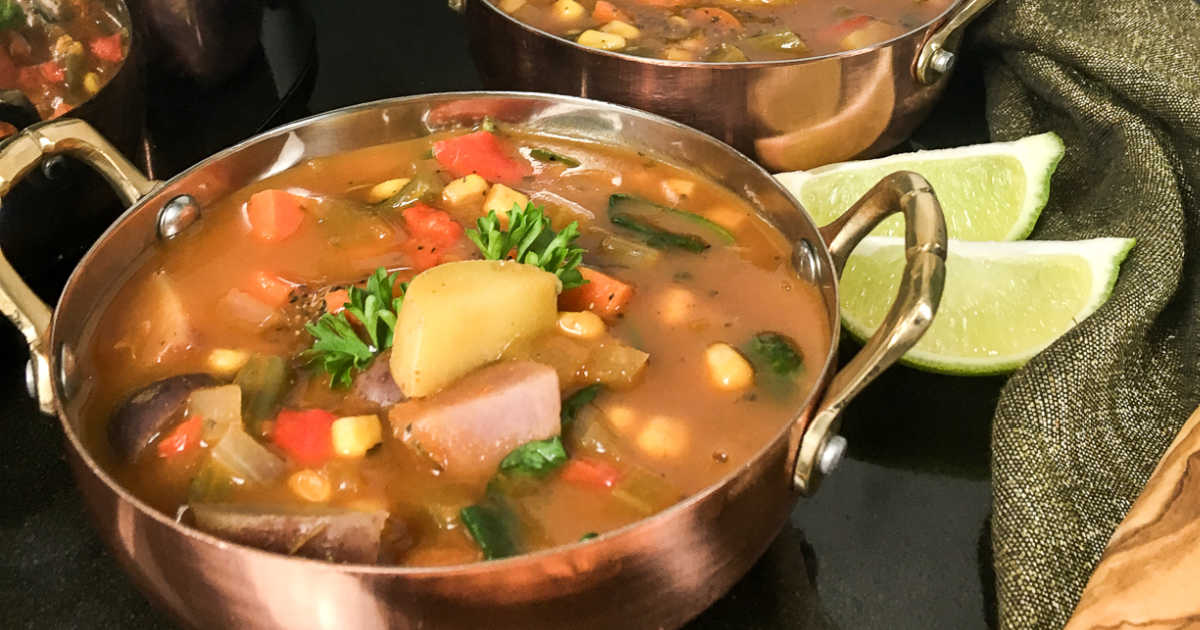 copper bowl of veggie soup