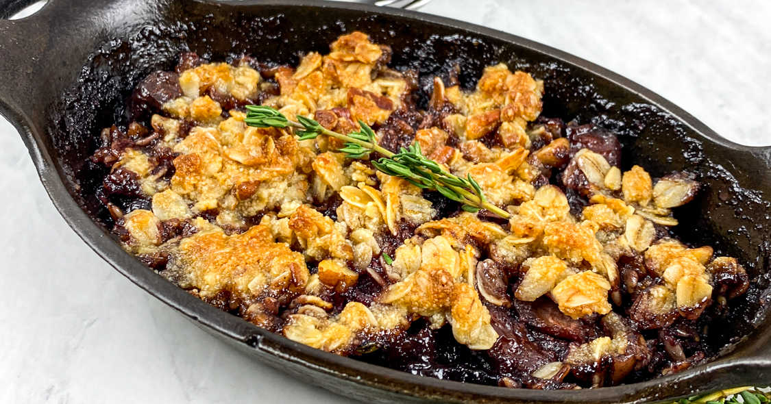 easy cherry crisp in cast iron pan.