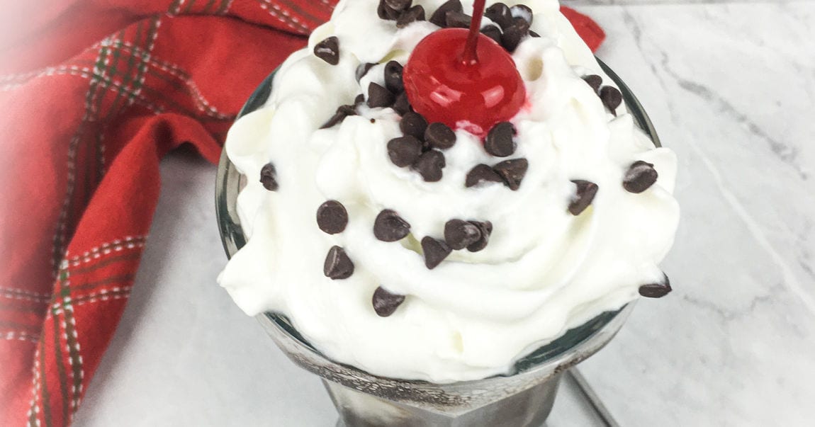 ice cream soda with cherry on top.