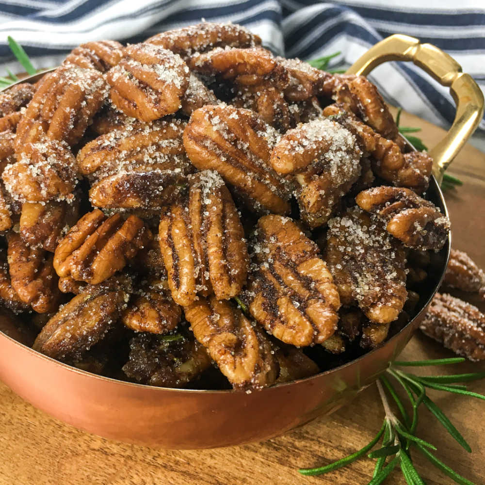 maple roasted hatch chile pecans in copper bowl.