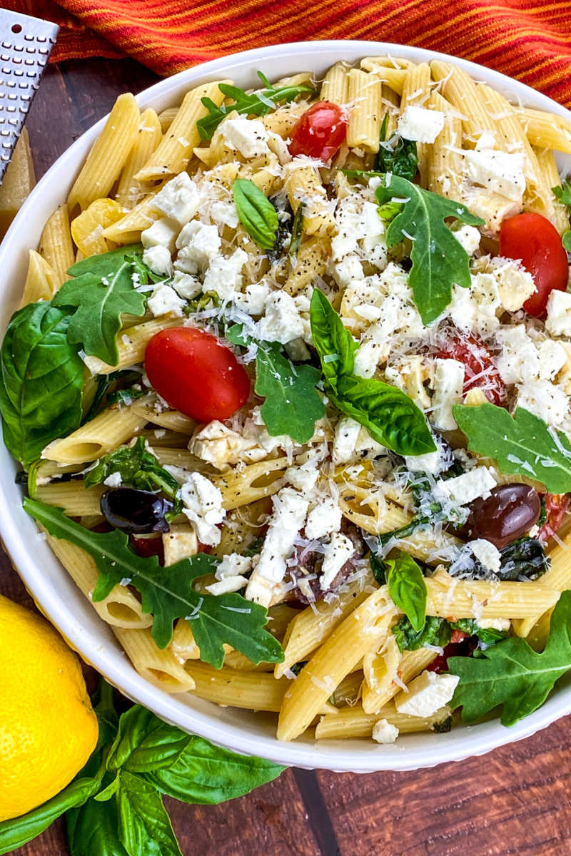 A Greek pasta salad with feta cheese is the perfect side dish, especially when it has a tangy lemon dressing and fresh ingredients.