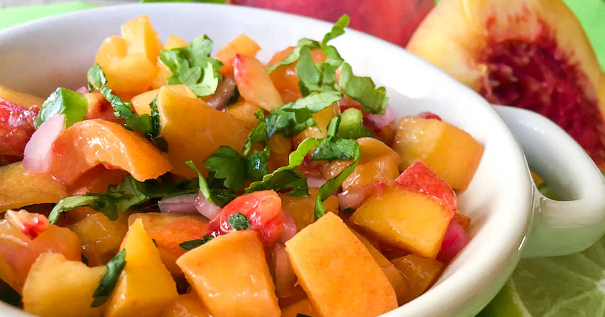 peach salsa in white bowl.