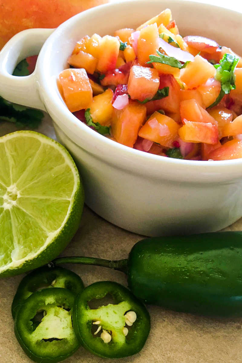 Add a burst of fresh fruit flavor to your snacks and meals, when you make this beautiful and delicious jalapeno peach salsa.