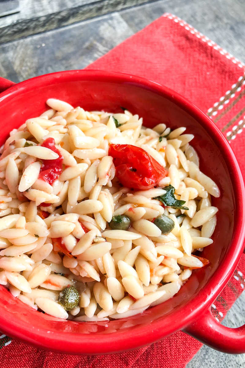 Enjoy this Mediterranean orzo salad with capers and fresh tomato, when you want a satisfying chilled pasta dish that is simple to prepare.