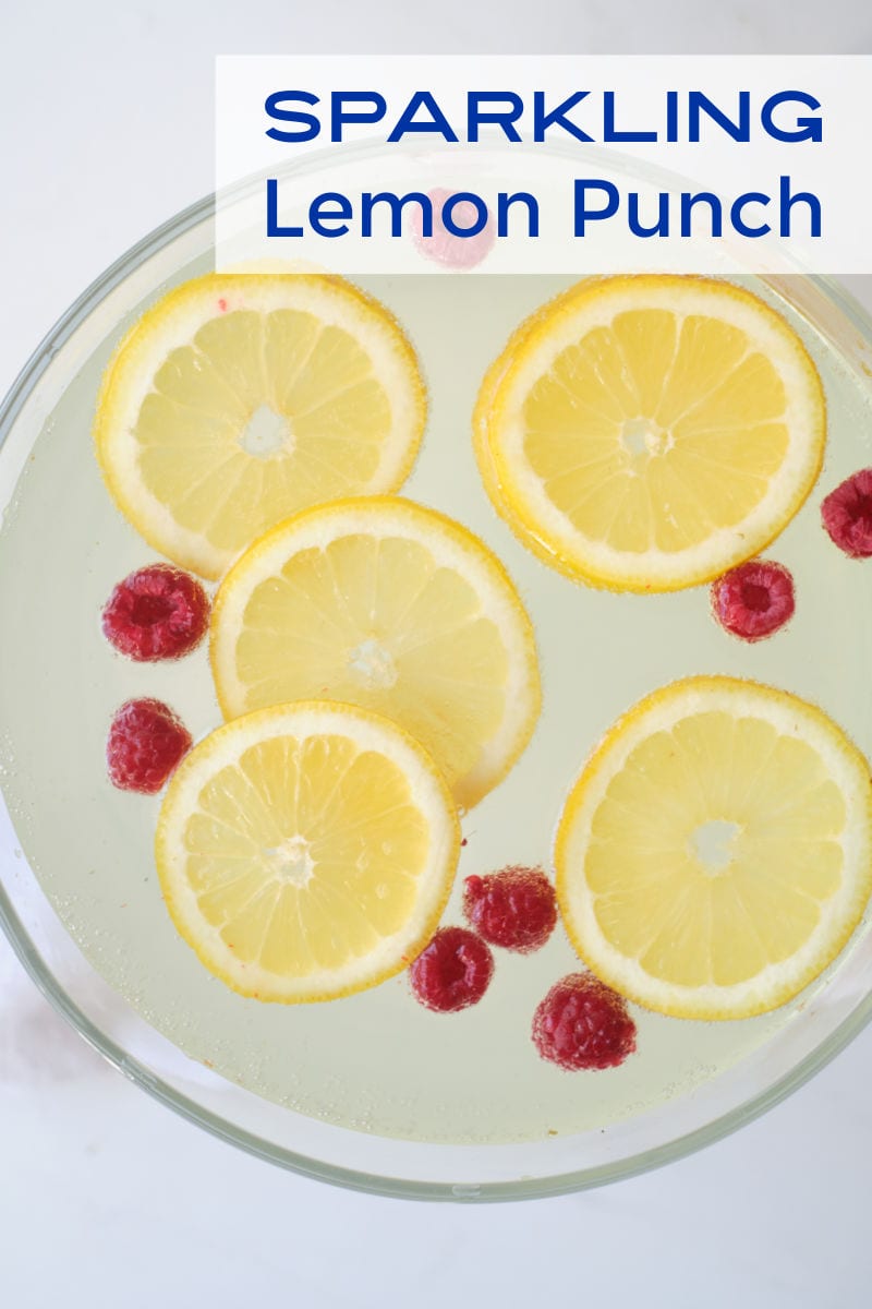 When you want a festive party punch without alcohol, make this sparkling lemonade punch garnished with lemon and raspberries.