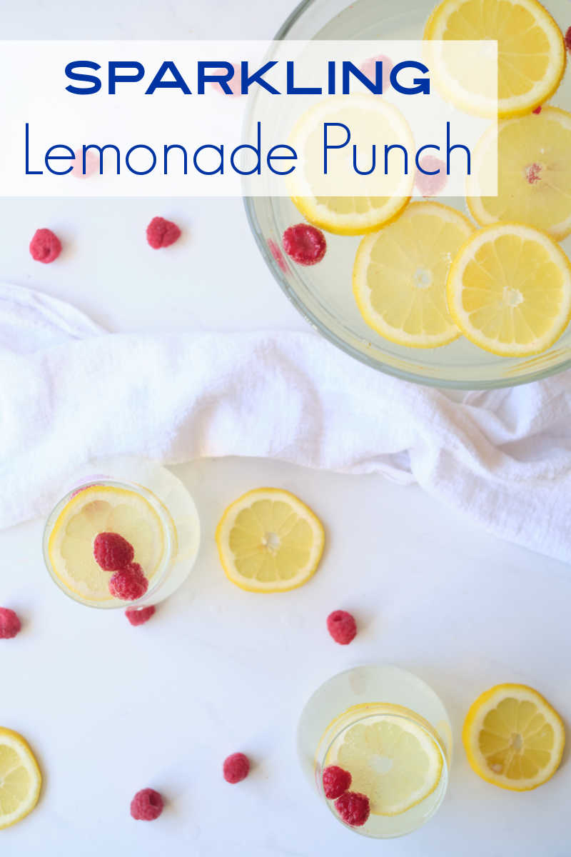 When you want a festive party punch without alcohol, make this sparkling lemonade punch garnished with lemon and raspberries.