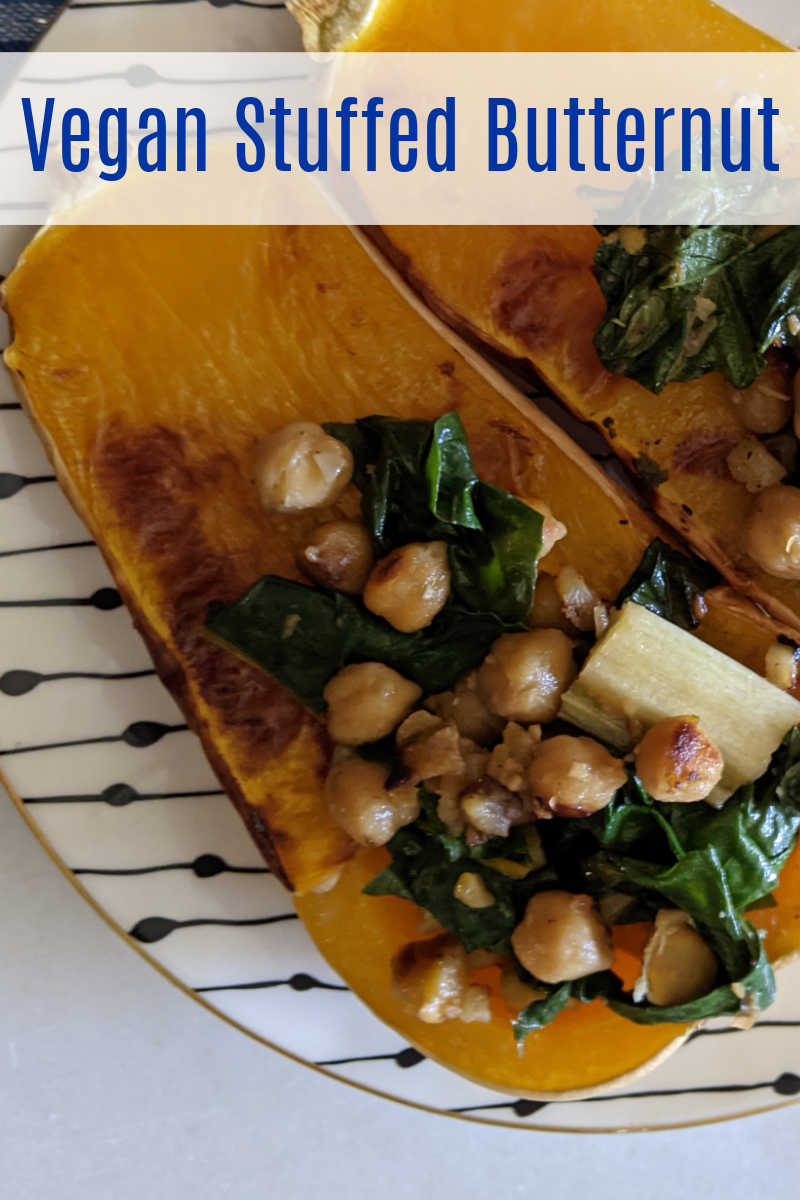 This vegan stuffed butternut squash is roasted is filled with a flavorful mix of chard and chickpeas, so it is delicious.