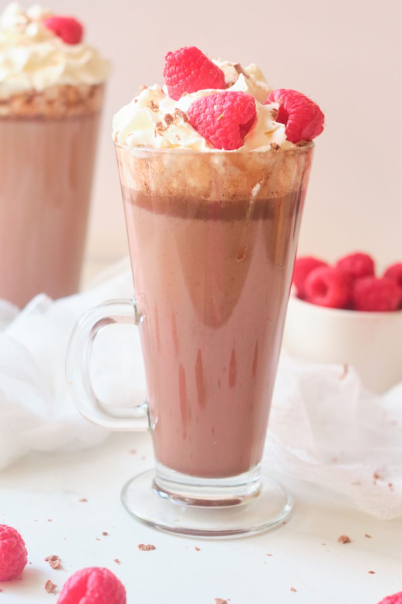 Learn how to make this delicious milk chocolate raspberry hot cocoa recipe. The warm chocolate drink is the perfect way to warm up on a cold winter day.
