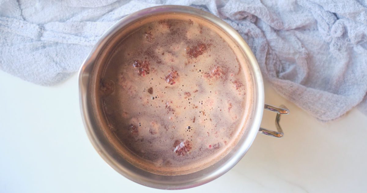 raspberry hot cocoa cooking in a saucepan