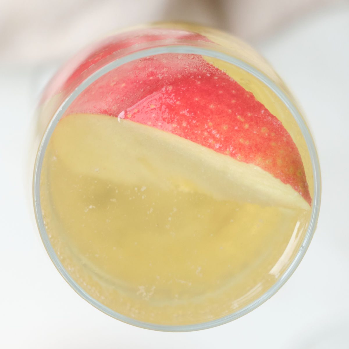 sparkling mocktail with apple garnish