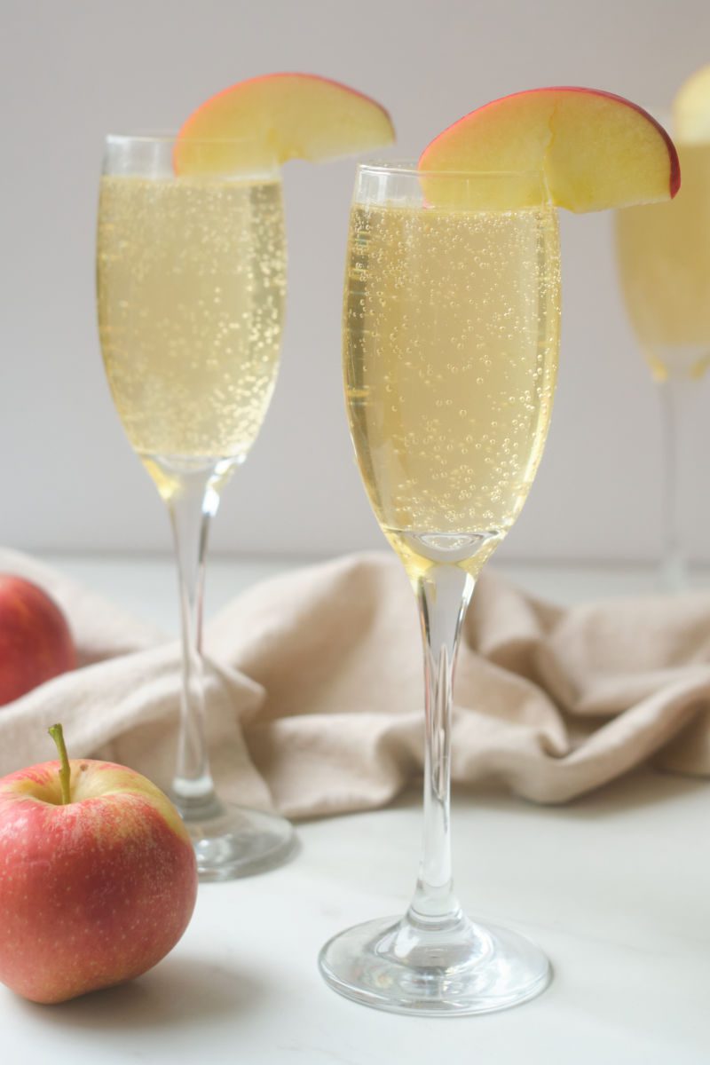 Sparkling drinks are fun! Learn how to make an easy non-alcoholic sparkling caramel apple mocktail that's perfect for kids and adults. Caramel sauce, apple juice and bubbles are the stars of this party drink.