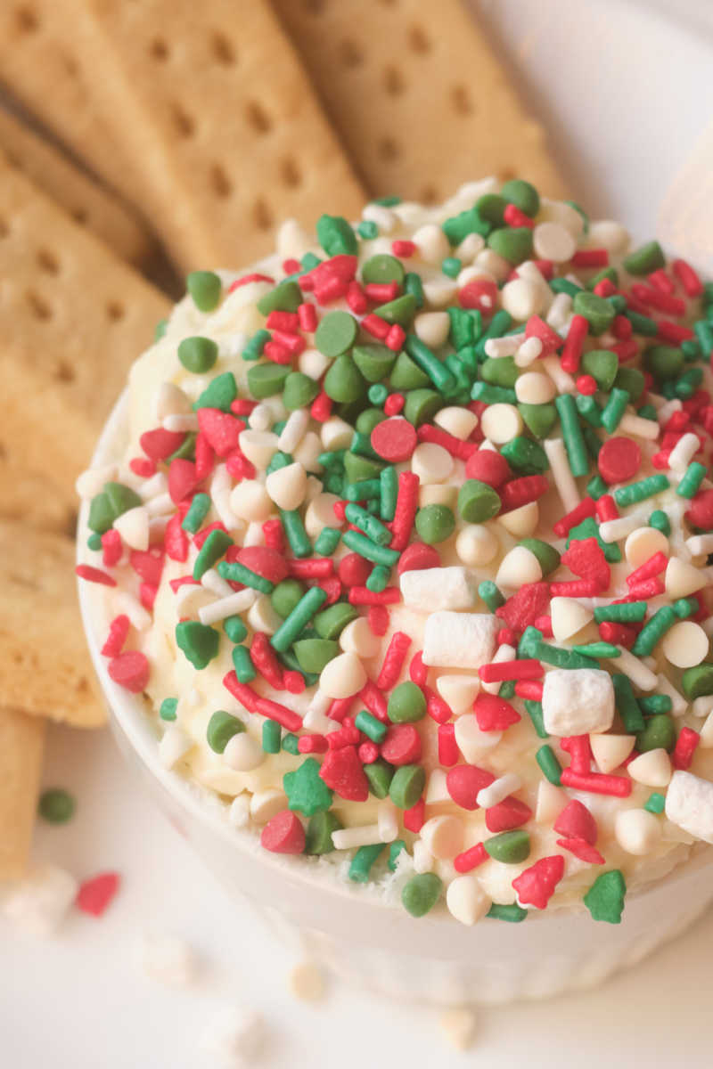 Festive Christmas cookie dip is a wonderful dessert treat, when it is topped with red and green sprinkles for the holidays. 