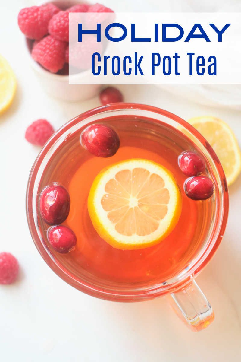Holiday Crock Pot tea tastes amazing, when you simmer black tea, cranberries, raspberries and citrus fruit in your slow cooker. 