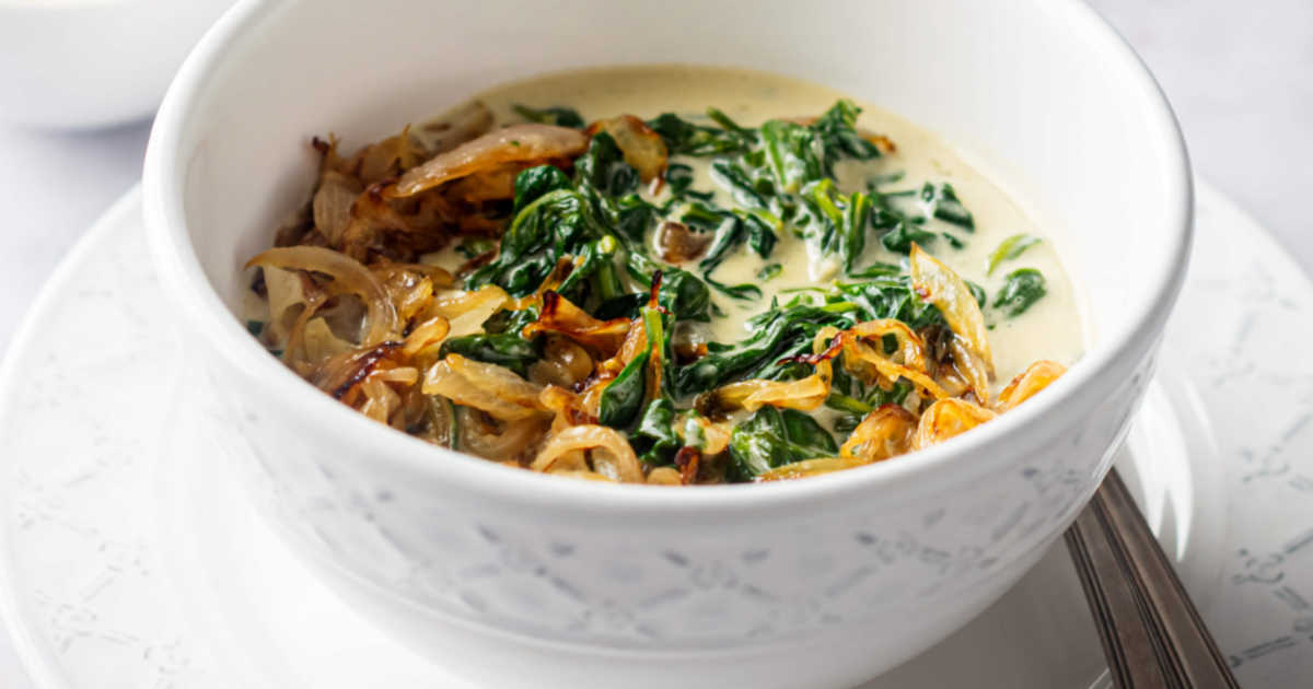 crispy onions on creamed spinach